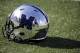 A Memphis football helmet sits on the turf before the start of an NCAA college football game between Memphis and Mississippi Saturday, Oct. 17, 2015, in Memphis, Tenn. (AP Photo/Mark Humphrey)