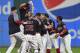Cleveland Indians' Jay Bruce, center, celebrates with teammates after Bruce drove in the winning run with a double off Kansas City Royals relief pitcher Brandon Maurer during the 10th inning of a baseball game, Thursday, Sept. 14, 2017, in Cleveland. The Indians won 3-2. (AP Photo/David Dermer)