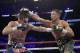 Gennady Golovkin, right, connects with a right to Canelo Alvarez during a middleweight title fight Sunday, Sept. 17, 2017, in Las Vegas. (AP Photo/John Locher)