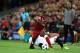 LIVERPOOL, ENGLAND - SEPTEMBER 13: Gabriel Mercado of Sevilla tackles Sadio Mane of Liverpool during the UEFA Champions League group E match between Liverpool FC and Sevilla FC at Anfield on September 13, 2017 in Liverpool, United Kingdom. (Photo by Stu Forster/Getty Images)