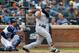 NEW YORK, NY - SEPTEMBER 13: Jacoby Ellsbury #22 of the New York Yankees follows through on an eighth inning double against the Tampa Bay Rays at Citi Field on September 13, 2017 in the Flushing neighborhood of the Queens borough of New York City. The two teams were scheduled to play in St. Petersburg, Florida but due to the weather emergency caused by Hurricane Irma, the game was moved to New York, but with Tampa Bay remaining the 'home' team. (Photo by Jim McIsaac/Getty Images)