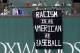 BOSTON, MA - SEPTEMBER 13: A banner with the message 'Racism is as American as baseball' is draped over the Green Monster during the fourth inning of the game between the Boston Red Sox and the Oakland Athletics at Fenway Park on September 13, 2017 in Boston, Massachusetts. (Photo by Maddie Meyer/Getty Images)