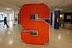 A Syracuse University logo is displayed inside the lobby of the Carmelo K. Anthony Basketball Center at Syracuse University in Syracuse, N.Y., Friday, Nov. 18, 2011. Bernie Fine, Syracuse University men's basketball associate head coach, was placed on administrative leave, Thursday, Nov. 17, after old child molesting allegations resurfaced.(AP Photo/David Duprey)