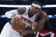 New York Knicks forward Carmelo Anthony, left, drives against Portland Trail Blazers forward Maurice Harkless during the second half of an NBA basketball game, Tuesday, Nov. 22, 2016, at Madison Square Garden in New York. The Knicks won 107-103. (AP Photo/Mary Altaffer)