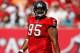 TAMPA, FL - NOVEMBER 13: Defensive tackle Albert Haynesworth #95 of the Tampa Bay Buccaneers walks back to the huddle against the Houston Texans during the game at Raymond James Stadium on November 13, 2011 in Tampa, Florida. (Photo by J. Meric/Getty Images)