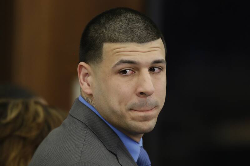 FILE - In this April 14, 2017, file pool photo, former New England Patriots tight end Aaron Hernandez turns to look in the direction of the jury as he reacts to his double murder acquittal after the sixth day of jury deliberations at Suffolk Superior Court in Boston. Massachusetts prosecutors on Friday, June 23, 2017, appealed a court ruling that erased the former NFL star's murder conviction in the 2013 killing of a semi-professional football player. Hernandez's conviction inwas voided after he killed himself in prison. Under a long-held Massachusetts legal principle, courts typically erase the convictions of defendants who die before their direct appeals can be heard. (AP Photo/Stephan Savoia, Pool, File)