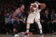 NEW YORK, NY - NOVEMBER 28: Carmelo Anthony #7 of the New York Knicks looks to pass around Andre Roberson #21 of the Oklahoma City Thunder during the second half at Madison Square Garden on November 28, 2016 in New York City. NOTE TO USER: User expressly acknowledges and agrees that, by downloading and or using this photograph, User is consenting to the terms and conditions of the Getty Images License Agreement. (Photo by Michael Reaves/Getty Images)