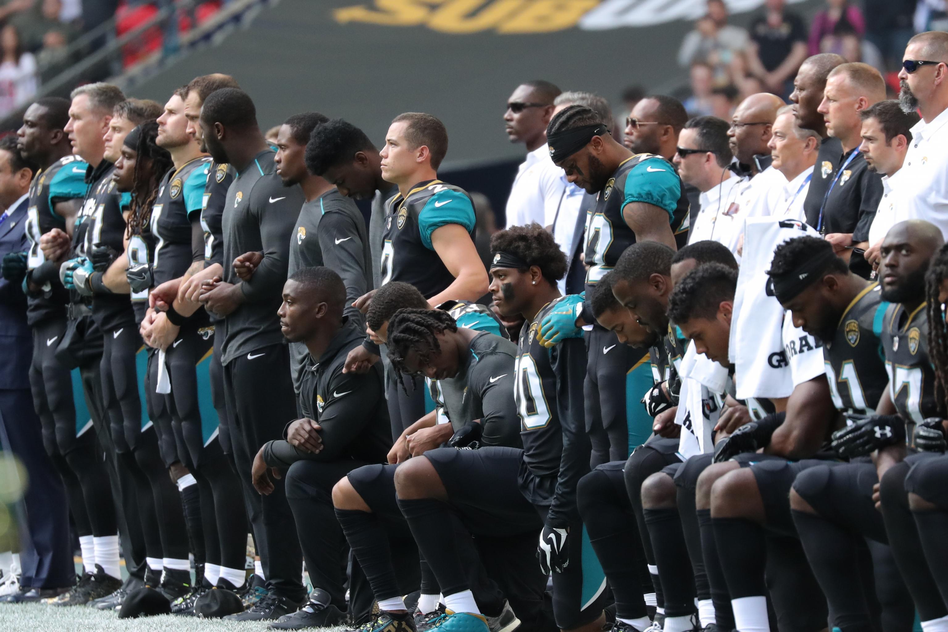 Players From the Baltimore Ravens and Jacksonville Jaguars Take A Knee  During The National Anthem, News