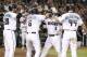 Arizona Diamondbacks' Chris Iannetta (8) is congratulated by teammates J.D. Martinez (28), David Peralta (6) and Paul Goldschmidt (44) after hitting a grand slam against the Miami Marlins during the sixth inning of a baseball game, Friday, Sept. 22, 2017, in Phoenix. It was Iannetta's second home run of the game. (AP Photo/Ralph Freso)