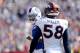 Buffalo Bills quarterback Tyrod Taylor, left, talks to Denver Broncos outside linebacker Von Miller (58) during the second half of an NFL football game, Sunday, Sept. 24, 2017, in Orchard Park, N.Y. (AP Photo/Adrian Kraus)