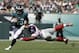 Philadelphia Eagles' Darren Sproles, left, tries to slip past New York Giants' Olivier Vernon during the first half of an NFL football game, Sunday, Sept. 24, 2017, in Philadelphia. (AP Photo/Michael Perez)
