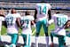 EAST RUTHERFORD, NJ - SEPTEMBER 24: Laremy Tunsil #67, Maurice Smith #27 and Julius Thomas #89 kneel with Jarvis Landry #14 of the Miami Dolphins during the National Anthem prior to an NFL game against the New York Jets at MetLife Stadium on September 24, 2017 in East Rutherford, New Jersey. (Photo by Steven Ryan/Getty Images)