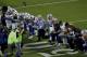 The Dallas Cowboys, led by owner Jerry Jones, center, take a knee prior to the national anthem prior to an NFL football game against the Arizona Cardinals, Monday, Sept. 25, 2017, in Glendale, Ariz. (AP Photo/Matt York)