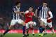 LONDON, ENGLAND - SEPTEMBER 25: Alexis Sanchez of Arsenal takes on Ahmed El-Sayed Hegazi and Gareth Barry of West Bromwich Albion during the Premier League match between Arsenal and West Bromwich Albion at Emirates Stadium on September 25, 2017 in London, England. (Photo by Michael Steele/Getty Images)