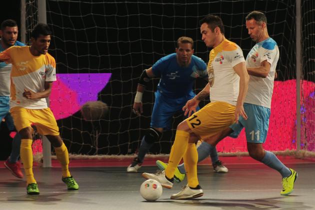 Alessandro Rosa Viera (2R), also known as Falcao, from the Chennai 5's plays against the Mumbai 5's during their Premier Futsal Football League match in Chennai on July 15, 2016. / AFP PHOTO / ARUN SANKAR (Photo credit should read ARUN SANKAR/AFP/Getty Images)