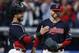 Cleveland Indians starting pitcher Corey Kluber, right, and catcher Yan Gomes celebrate a 2-0 victory over the Detroit Tigers in a baseball game, Tuesday, Sept. 12, 2017, in Cleveland. (AP Photo/Ron Schwane)