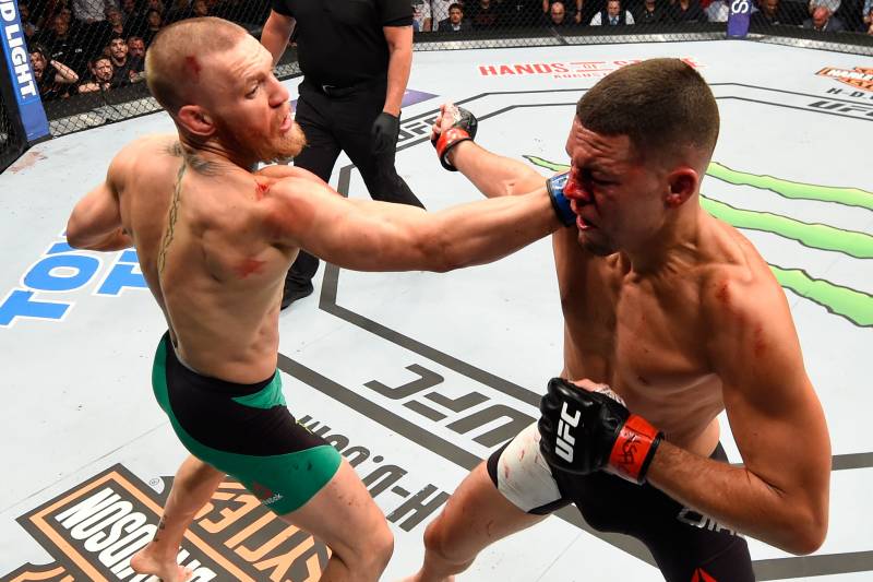 LAS VEGAS, NV - AUGUST 20: (L-R) Conor McGregor of Ireland punches Nate Diaz in their welterweight bout during the UFC 202 event at T-Mobile Arena on August 20, 2016 in Las Vegas, Nevada. (Photo by Josh Hedges/Zuffa LLC/Zuffa LLC via Getty Images)