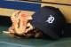 DETROIT, MI - SEPTEMBER 04: A detailed view of the baseball glove and hat used by Jeimer Candelario #46 of the Detroit Tigers sitting in the dugout during the game against the Kansas City Royals at Comerica Park on September 4, 2017 in Detroit, Michigan. The Royals defeated the Tigers 7-6. (Photo by Mark Cunningham/MLB Photos via Getty Images)