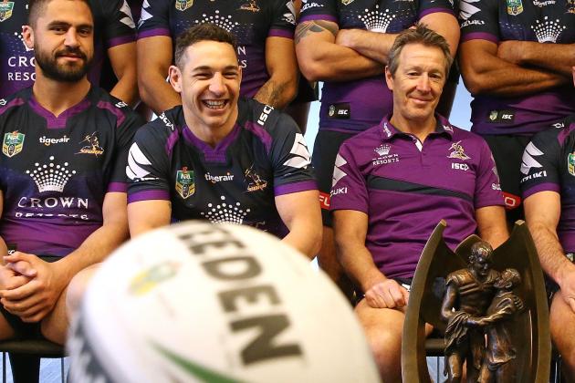 MELBOURNE, AUSTRALIA - SEPTEMBER 25: Jesse Bromwich, Billy Slater and coach Craig Bellamy watch as a ball bounces as they pose for their team photo with the Provan-Summons trophy during a Melbourne Storm NRL training session at Gosch's Paddock on September 25, 2017 in Melbourne, Australia. (Photo by Scott Barbour/Getty Images)