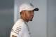 KUALA LUMPUR, MALAYSIA - SEPTEMBER 28: Lewis Hamilton of Great Britain and Mercedes GP talks in the garage during previews for the Malaysia Formula One Grand Prix at Sepang Circuit on September 28, 2017 in Kuala Lumpur, Malaysia. (Photo by Clive Mason/Getty Images)