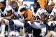 Denver Broncos players, including Jamaal Charles (28) kneel during the national anthem prior to an NFL football game against the Buffalo Bills, Sunday, Sept. 24, 2017, in Orchard Park, N.Y. (AP Photo/Jeffrey T. Barnes)