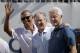 Former U.S. Presidents, from left, Barack Obama, George Bush and Bill Clinton greet spectators on the first tee before the first round of the Presidents Cup at Liberty National Golf Club in Jersey City, N.J., Thursday, Sept. 28, 2017. (AP Photo/Julio Cortez)