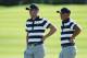 JERSEY CITY, NJ - SEPTEMBER 28: Rickie Fowler and Justin Thomas of the U.S. Team talk on the eighth green as they play against Hideki Matsuyama of Japan and the International Team and Charl Schwartzel of South Africa and the International Team during Thursday foursome matches of the Presidents Cup at Liberty National Golf Club on September 28, 2017 in Jersey City, New Jersey. (Photo by Rob Carr/Getty Images)