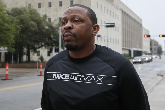 Lamont Evans, an assistant basketball coach at Oklahoma State University, leaves the federal courthouse following a court appearance in Oklahoma City, Wednesday, Sept. 27, 2017. Evans is facing federal charges in conjunction with a wide probe of fraud and corruption in the NCAA. (AP Photo/Sue Ogrocki)