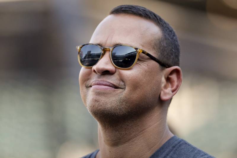 CORRECTS TO LOS ANGELES DODGERS, INSTEAD OF ANGELS - Former New York Yankees player Alex Rodriguez watches batting practice before a baseball game between the New York Mets and the Los Angeles Dodgers on Friday, Aug. 4, 2017, in New York. (AP Photo/Julie Jacobson)