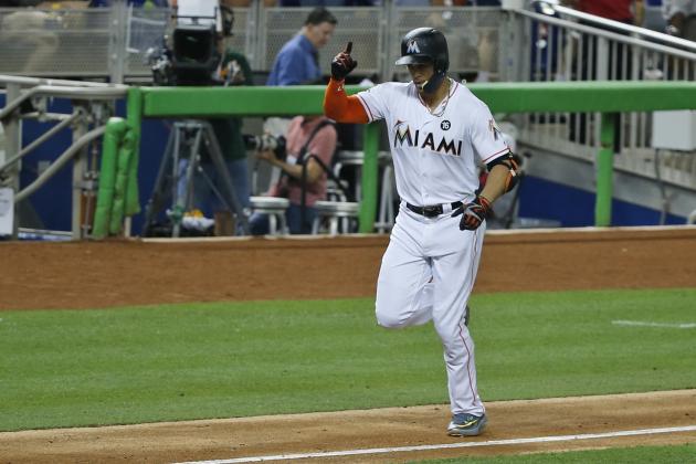 Miami Marlins' Giancarlo Stanton celebrates as heads for home plate after hitting a home run during the fourth inning of a baseball game against the Atlanta Braves, Thursday, Sept. 28, 2017, in Miami. (AP Photo/Wilfredo Lee)