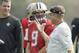 New Orleans Saints quarterback Drew Brees talks to head coach Sean Payton, right, during an NFL training session at the London Irish rugby team training ground in the Sunbury-on-Thames suburb of south west London, Wednesday, Sept. 27, 2017. The New Orleans Saints are preparing for an NFL regular season game against the Miami Dolphins at London's Wembley stadium on Sunday. (AP Photo/Matt Dunham)