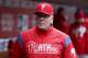 Philadelphia Phillies manager Pete Mackanin works in the dugout in the fourth inning of a baseball game against the Cincinnati Reds, Thursday, April 6, 2017, in Cincinnati. The Reds won 7-4. (AP Photo/John Minchillo)