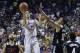 Los Angeles Lakers' Lonzo Ball shoots over Los Angeles Clippers' Brice Johnson (10) during overtime of an NBA summer league basketball game, Friday, July 7, 2017, in Las Vegas. (AP Photo/John Locher)
