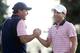 Phil Mickelson and Kevin Kisner celebrate after winning their Friday match at the Presidents Cup.