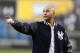 Retired New York Yankees shortstop Derek Jeter waves to the Houston Astros dugout following a pregame ceremony retiring his number 2 in Monument Park at Yankee Stadium in New York, Sunday, May 14, 2017. (AP Photo/Pool, Kathy Willens)