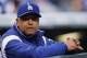 Los Angeles Dodgers manager Dave Roberts looks on in the first inning of a baseball game against the Colorado Rockies, Friday, Sept. 29, 2017, in Denver. (AP Photo/David Zalubowski)