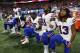 Buffalo Bills players take a knee during the national anthem before the first half of an NFL football game between the Atlanta Falcons and the Buffalo Bills, Sunday, Oct. 1, 2017, in Atlanta. (AP Photo/John Bazemore)