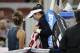 Garbine Muguruza of Spain, center, walks past her opponent Barbara Strycova of the Czech Republic, left, as she leaves the court after retiring from their women's singles match at the China Open tennis tournament at the Diamond Court in Beijing, Monday, Oct. 2, 2017. (AP Photo/Andy Wong)