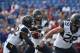 LAWRENCE, KS - SEPTEMBER 23: Will Grier #7 of the West Virginia Mountaineers hands the ball of to Martell Pettaway #32 against the Kansas Jayhawks at Memorial Stadium on September 23, 2017 in Lawrence, Kansas. (Photo by Ed Zurga/Getty Images)