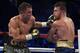 LAS VEGAS, NV - SEPTEMBER 16: Gennady Golovkin punches Canelo Alvarez during their WBC, WBA and IBF middleweight championship bout at T-Mobile Arena on September 16, 2017 in Las Vegas, Nevada. (Photo by Al Bello/Getty Images)
