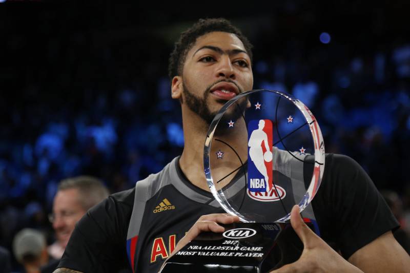 Western Conference forward Anthony Davis of the New Orleans Pelicans (23) lifts the Most Valuable Player trophy after the NBA All-Star basketball game in New Orleans, Sunday, Feb. 19, 2017. (AP Photo/Max Becherer)