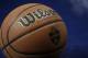 A basketball is seen on the court wight he SEC logo during the second half of the NCAA college basketball Southeastern Conference tournament championship game between Kentucky and Arkansas, Sunday, March 15, 2015, in Nashville, Tenn. (AP Photo/Mark Humphrey)
