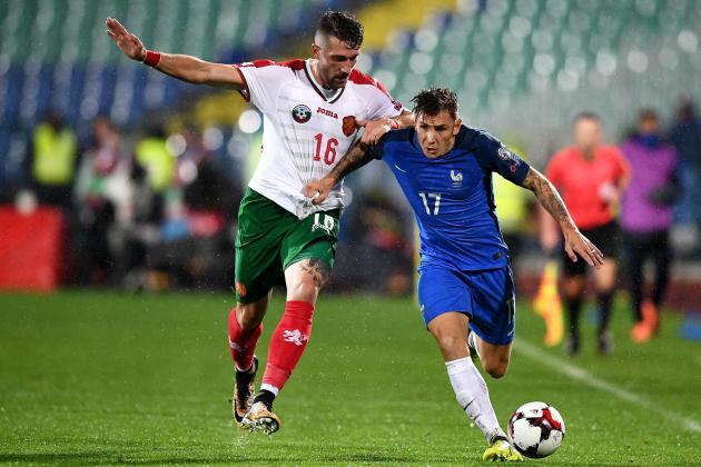 Bulgaria's forward Andrey Galabinov (L) fights for the ball with France's defender Lucas Digne during the FIFA World Cup 2018 qualifying football match between Bulgaria and France at The Vasil Levski Stadium in Sofia on October 7, 2017. / AFP PHOTO / FRANCK FIFE        (Photo credit should read FRANCK FIFE/AFP/Getty Images)