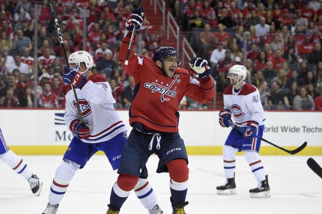 Washington Capitals left wing Alex Ovechkin (8), of Russia, celebrates his goal next to Montreal Canadiens defenseman Karl Alzner (22) during the first period of a NHL hockey game, Saturday, Oct. 7, 2017, in Washington. This was Ovechkin's third goal of the period and the game. (AP Photo/Nick Wass)