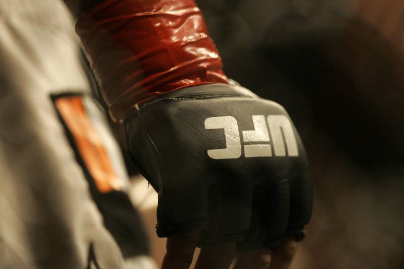 Closeup of a glove and the UFC logo at Ultimate Fighting Championship 73 on Saturday, July 7, 2007, in Sacramento, Calif. (AP Photo/Jeff Chiu)