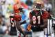 CHARLOTTE, NC - SEPTEMBER 26: Chad Ochocinco #85 and teammate Terrell Owens #81 of the Cincinnati Bengals wait for a play against the Carolina Panthers during their game at Bank of America Stadium on September 26, 2010 in Charlotte, North Carolina. (Photo by Streeter Lecka/Getty Images)