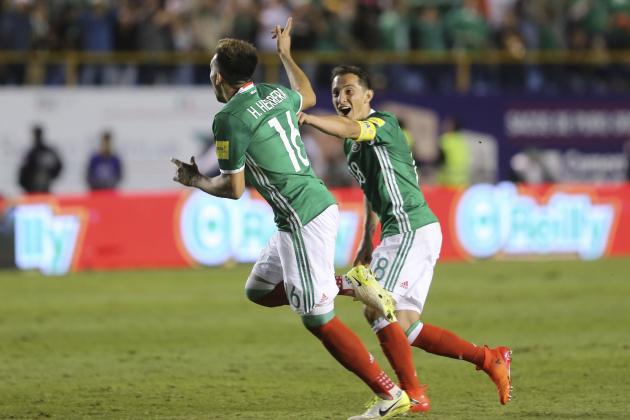 Mexico's Hector Herrera (16) celebrates scoring his side's third goal against Trinidad and Tobago with teammate Andres Guardado, during a World Cup qualifying soccer match in San Luis Potosi, Mexico, Friday, Oct. 6, 2017. (AP Photo/Christian Palma)