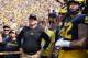 ANN ARBOR, MI - SEPTEMBER 16: Michigan Wolverines head foot all coach Jim Harbaugh gets ready to lead his team onto the field prior to the start of the game against Air Force Falcons at Michigan Stadium on September 16, 2017 in Ann Arbor, Michigan. Michigan defeated Air Force Falcons 29-13. (Photo by Leon Halip/Getty Images)