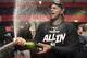 New York Yankees starting pitcher Luis Severino sprays sparkling wine in the locker room the Yankees defeated the Cleveland Indians 5-2 in Game 5 of a baseball American League Division Series, early Thursday, Oct. 12, 2017, in Cleveland. The Yankees advanced to the ALCS. (AP Photo/David Dermer)