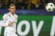 Real Madrid's Gareth Bale watches the ball go into the net as he scores his side's first goal during a Champions League Group H soccer match between Borussia Dortmund and Real Madrid at the BVB stadium in Dortmund, Germany, Tuesday, Sept. 26, 2017. (AP Photo/Michael Probst)